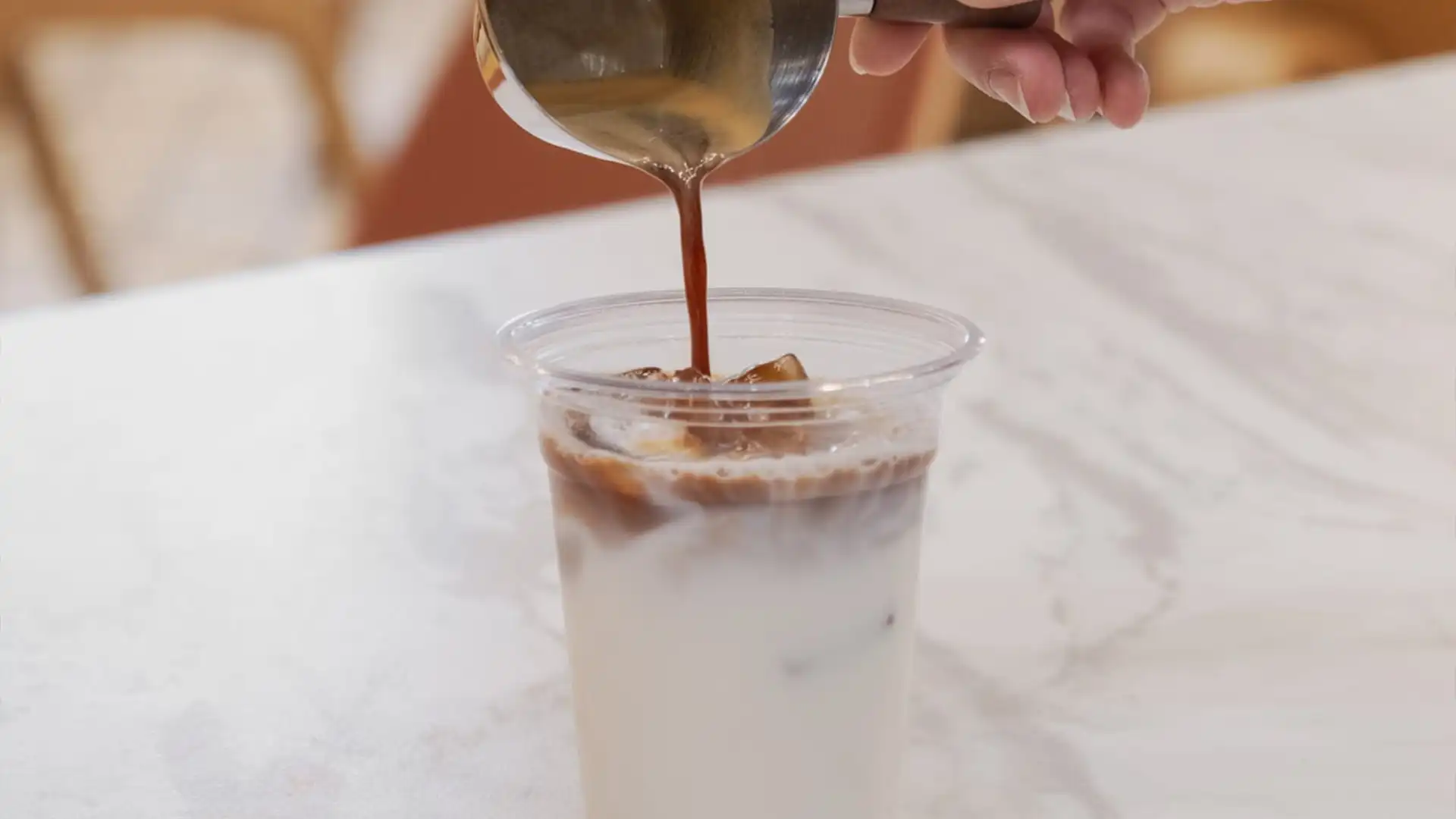 A cozy European-style coffee shop in Richmond, TX with warm lighting, showing a quiet workspace and bakery atmosphere ideal for remote work, studying, and enjoying fresh pastries and coffee.